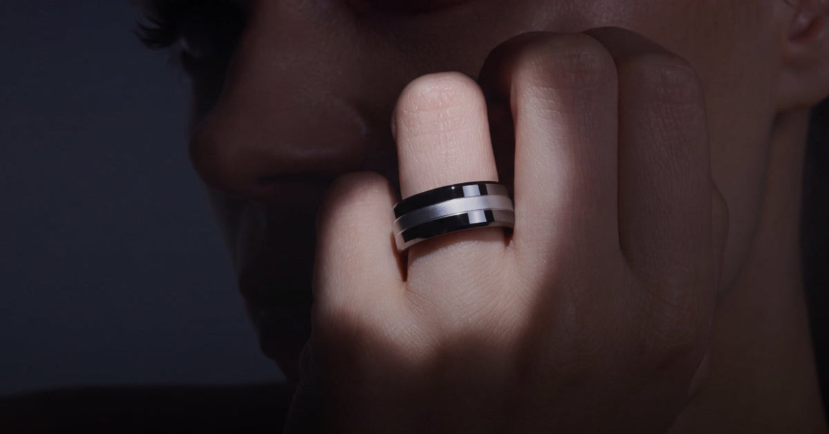Official Vital Signals photo of a person wearing the Signal Ring on an index finger