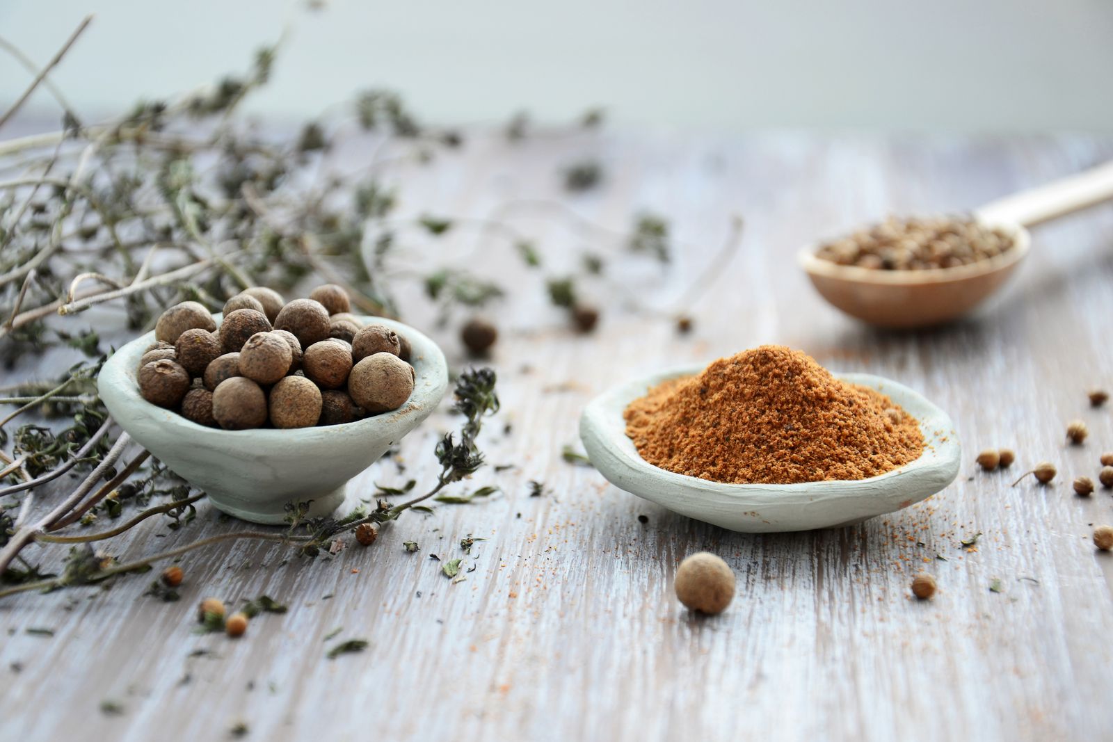 Whole peppercorns and ground spice in bowls, curcumin black pepper absorption | Healthcare Discovery